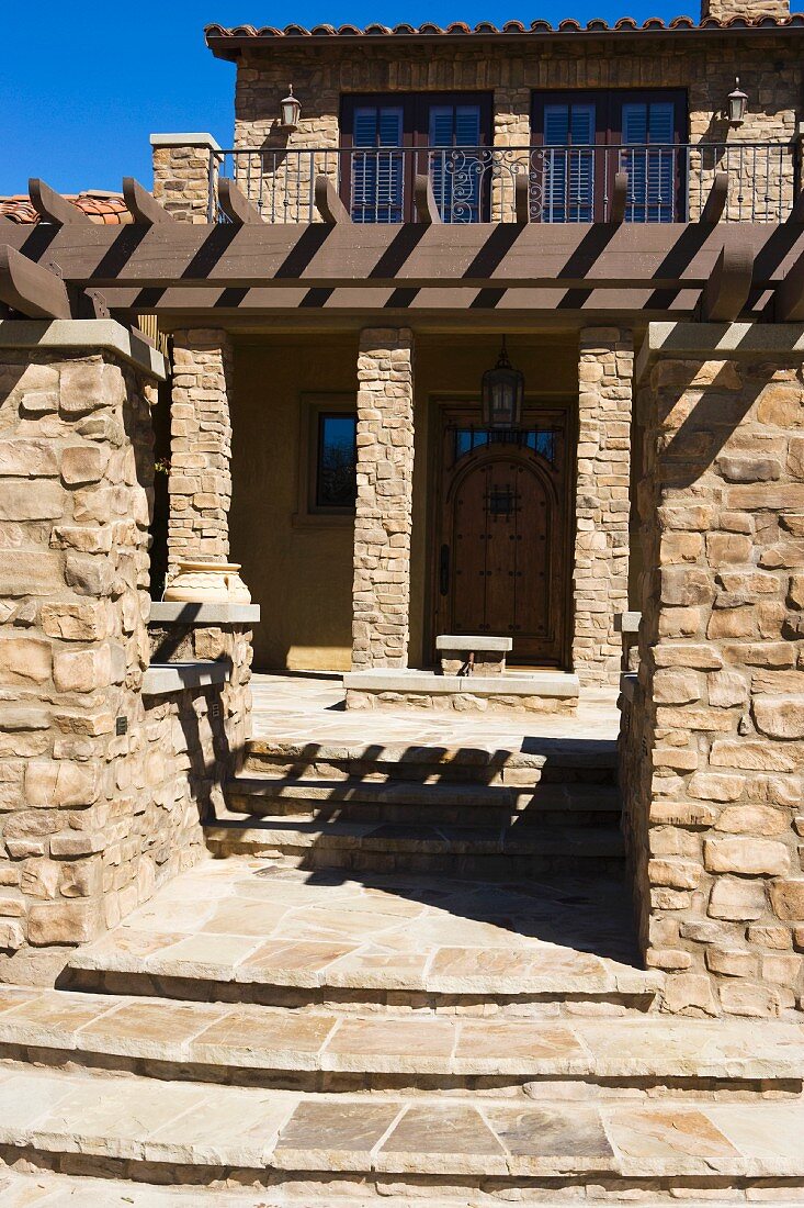 Front entrance to Tuscan style home
