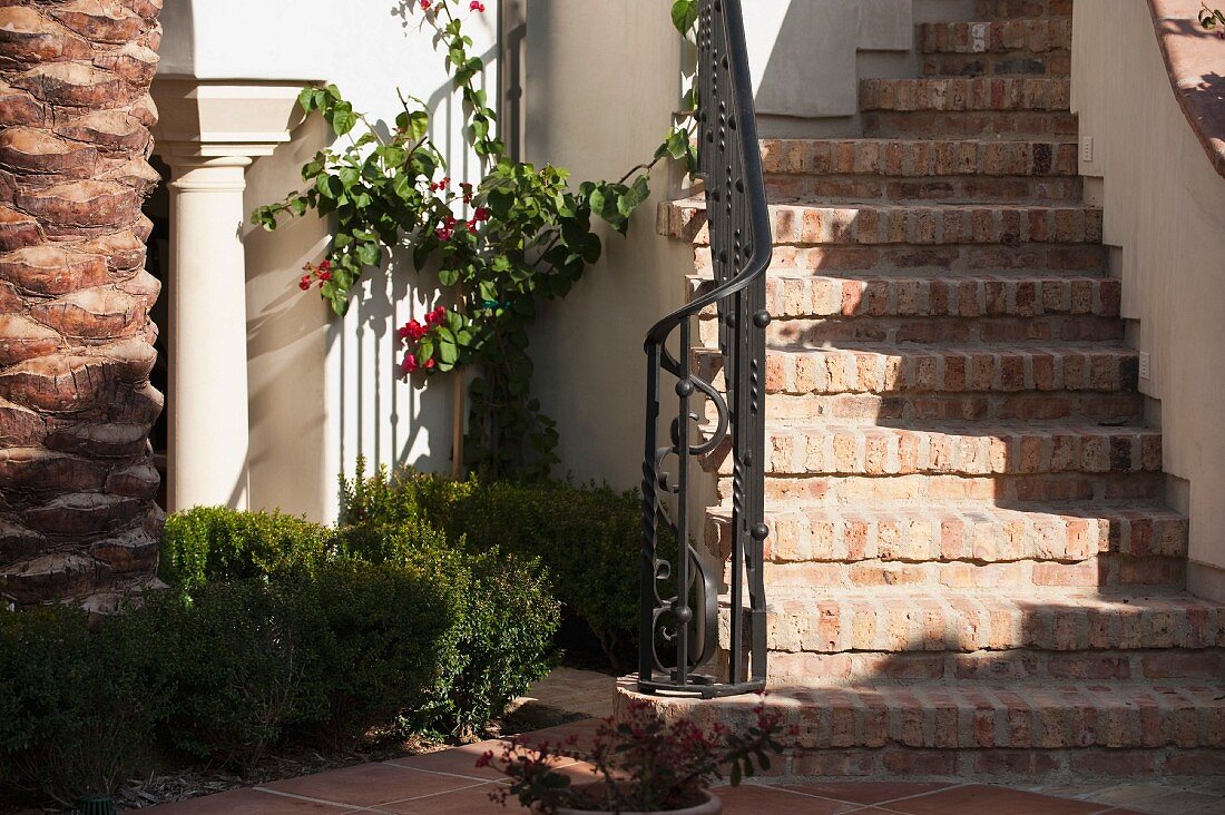Brick staircase with wrought iron railing