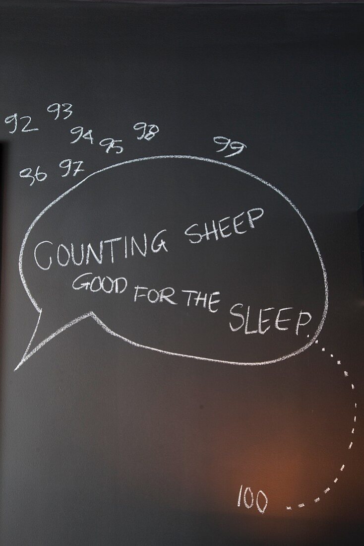 Counting sheep - tip for nodding off written on blackboard wall