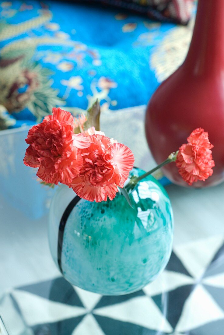 Pinks in turquoise glass vase