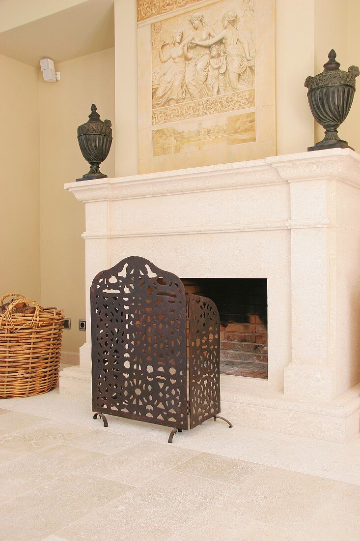 Fireplace screen in front of stone fireplace