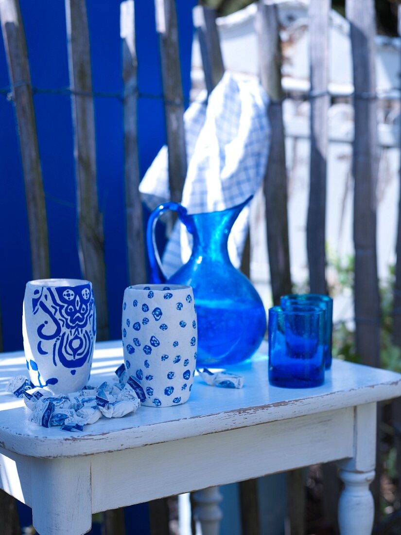 Blue and white crockery on a small wooden table