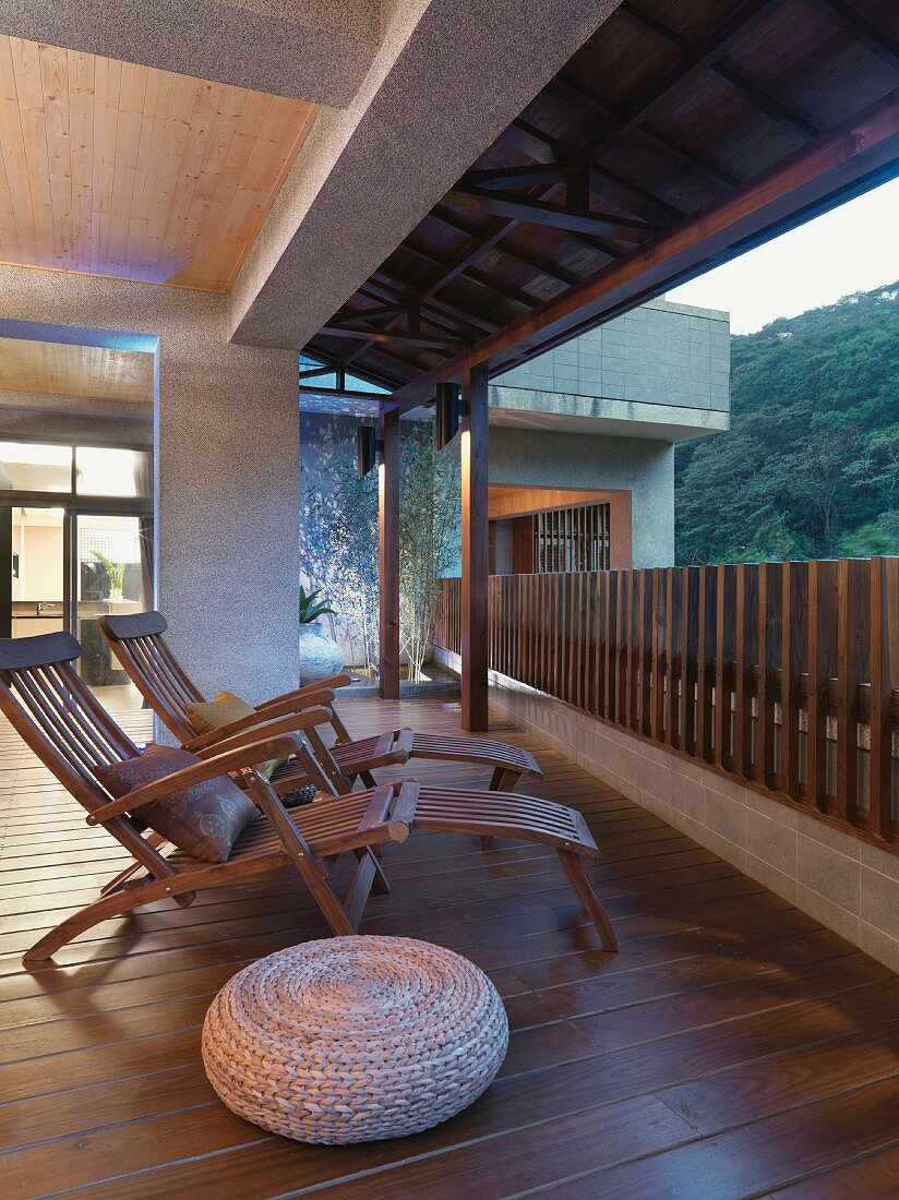 Wooden lounge chairs on hardwood deck