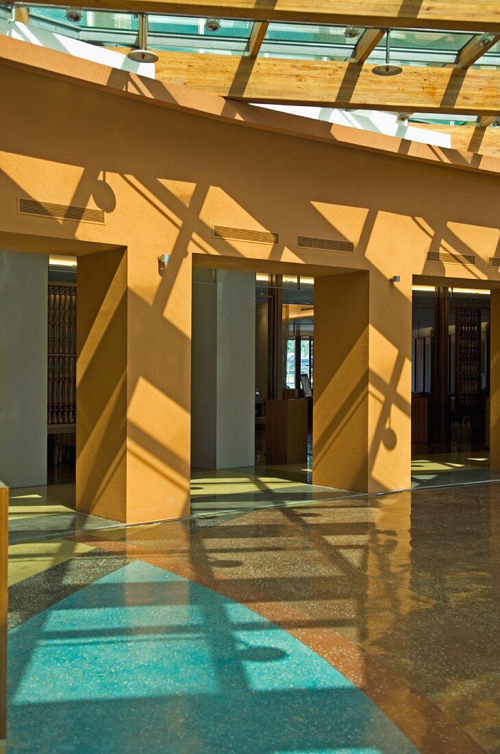 Shadows from sky lights over lobby and marble floor