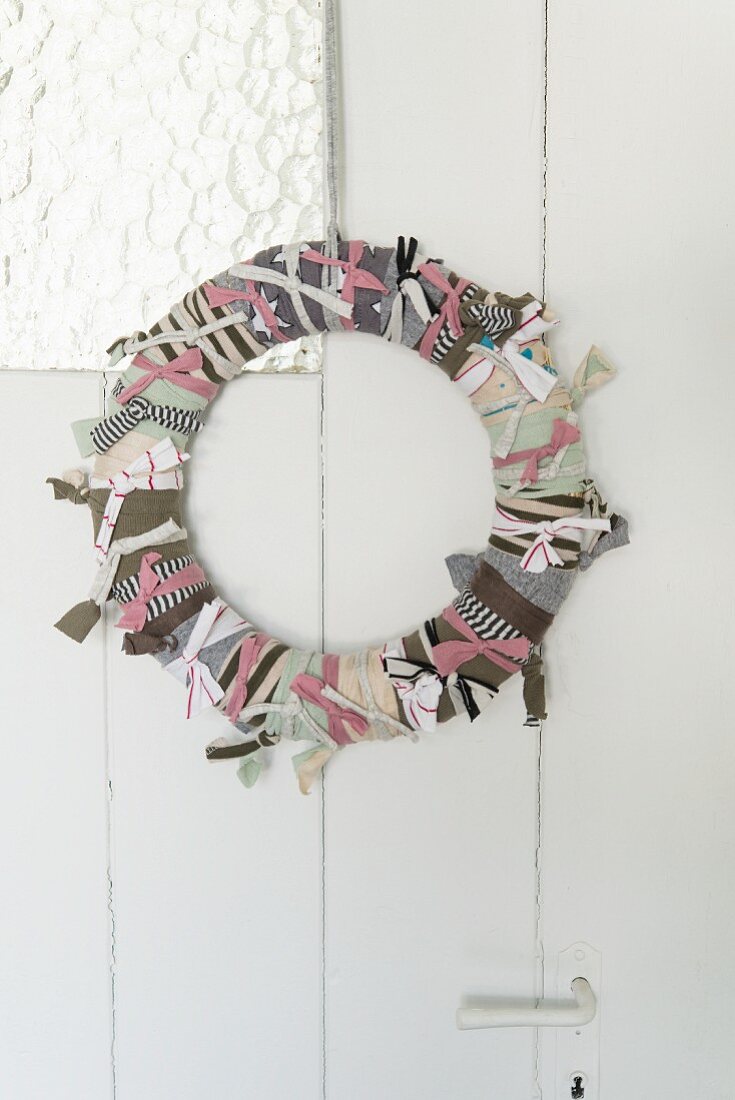 A homemade wreath made from strips of fabric