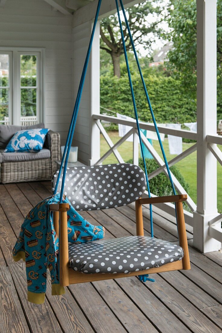 A homemade swing on a veranda