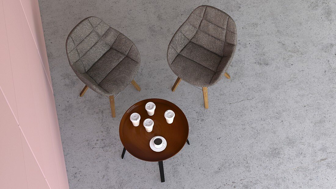 Blick von Oben auf Sitzecke mit zwei Stühlen & rundem Coffeetable