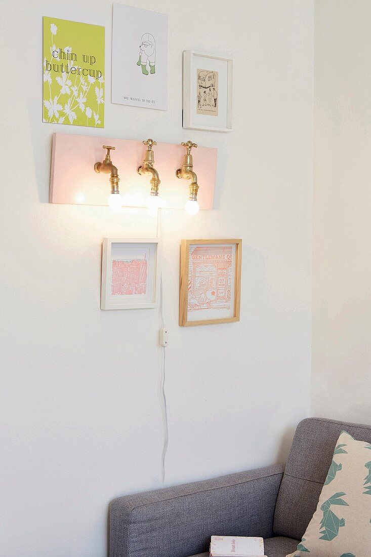 DIY wall-mounted lamp made from brass taps