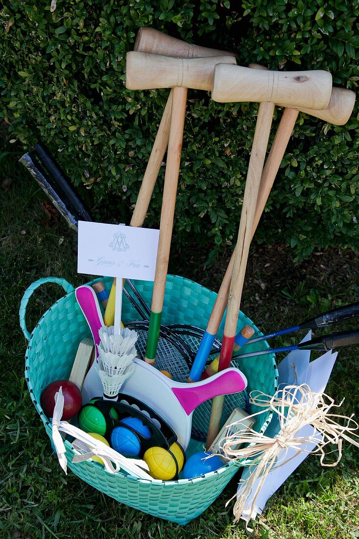 Various outdoor games in turquoise basket
