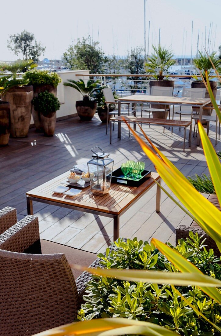 Outdoor furniture on Mediterranean terrace with wooden floor