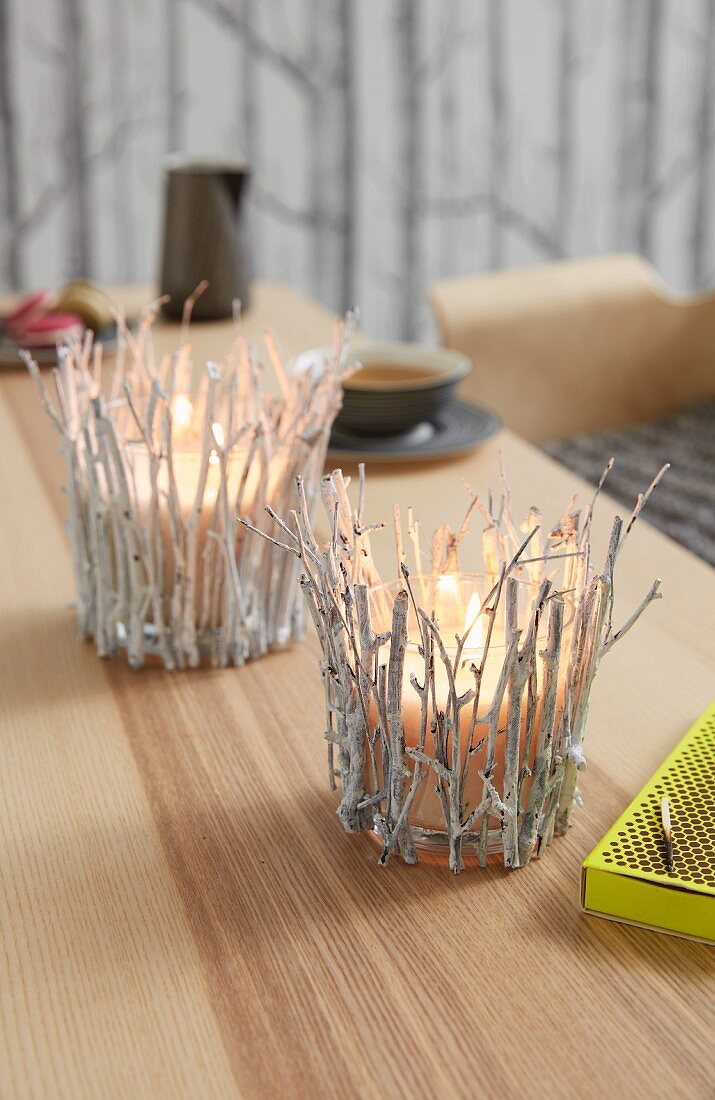Tea lights decorated with birch twigs