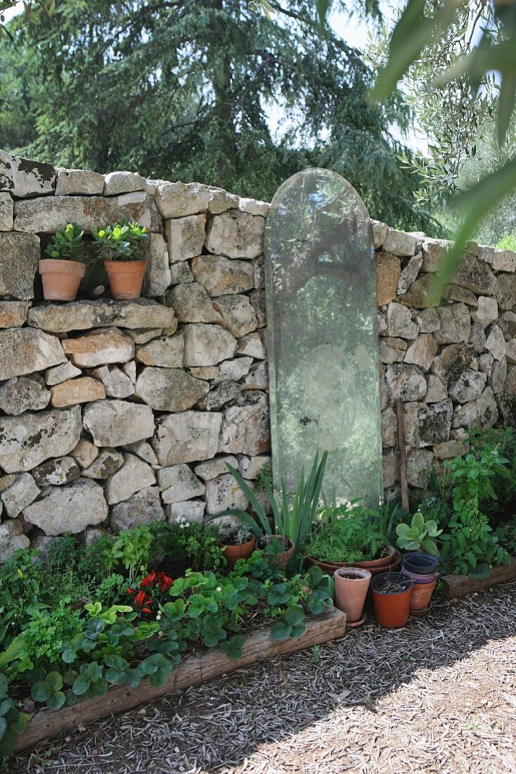 Mediterranean stone wall in garden