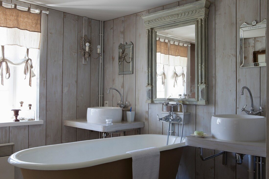 Vintage-style bathroom with board walls