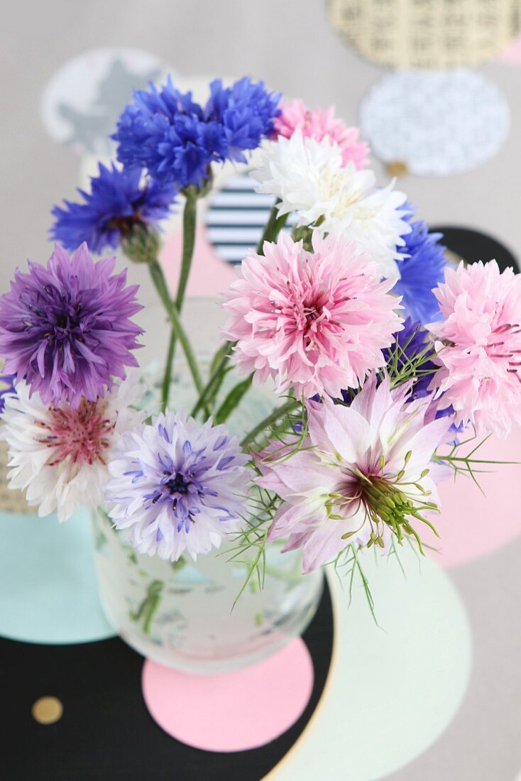 Pastel posy of cornflowers and love-in-a-mist