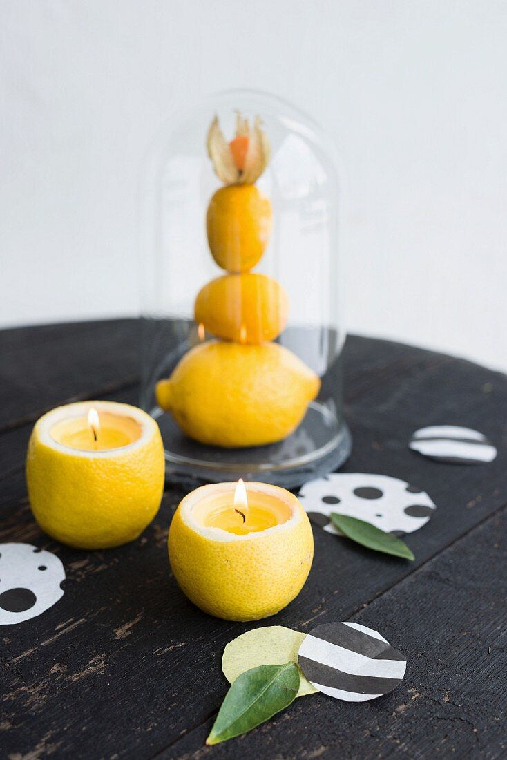 Selbstgemachte Zitronen-Kerzenhalter und Konfetti als Tischdeko