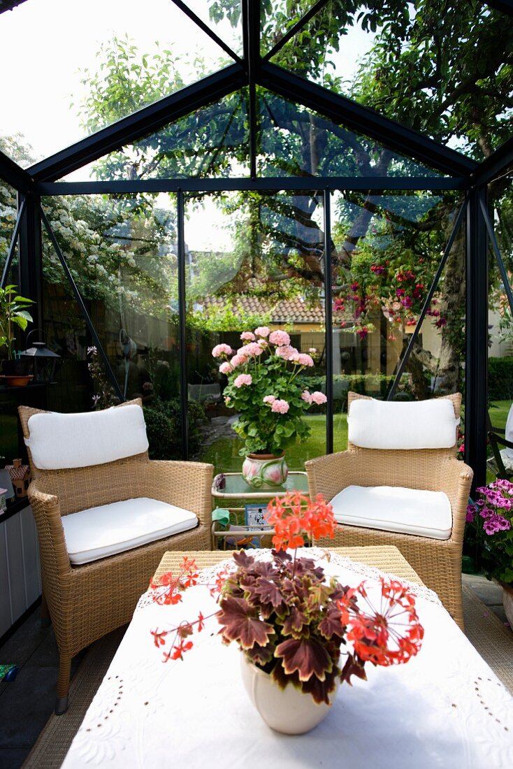 Seating area in conservatory in garden