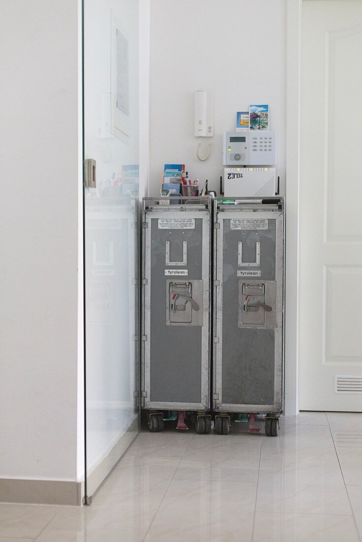 Two airline hostess trolleys in hallway