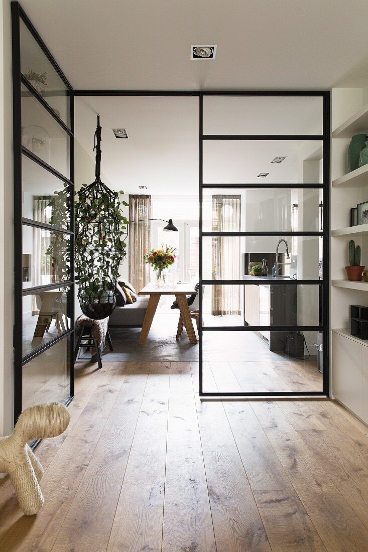 View into modern dining room through glass doors