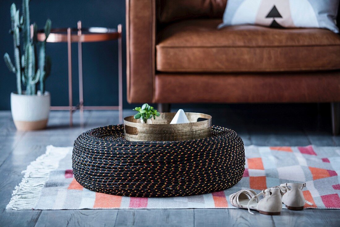Homemade coffee table made from old tires and rope