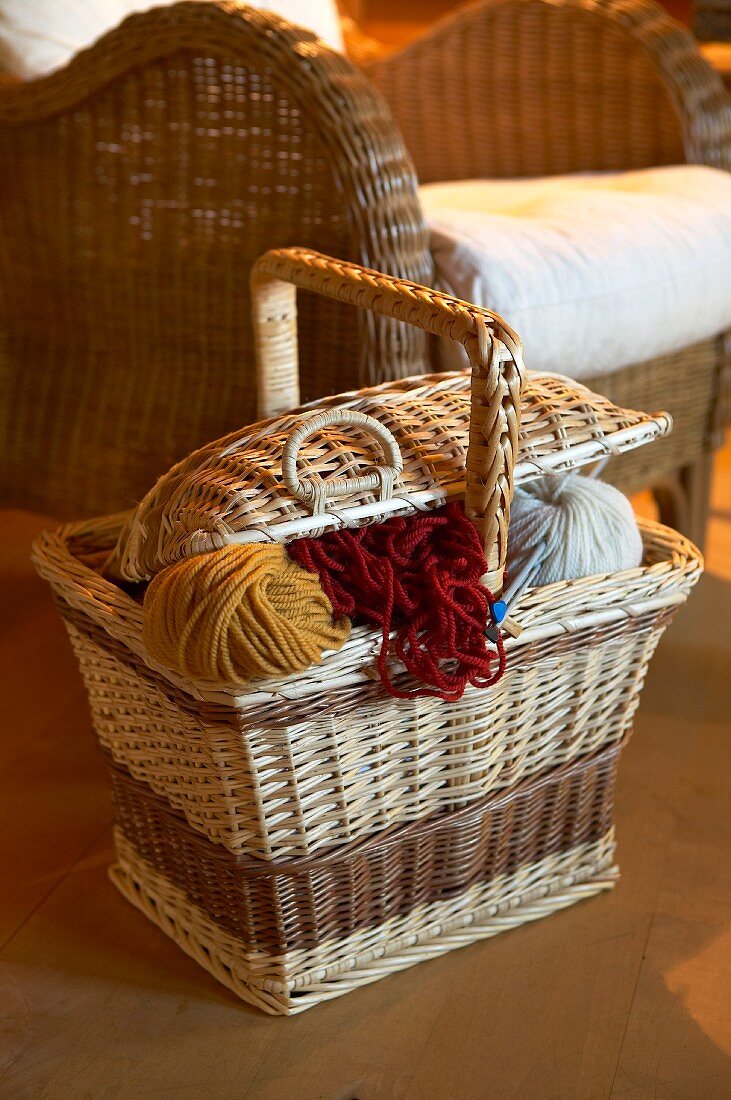 Knitting basket next to wicker chair