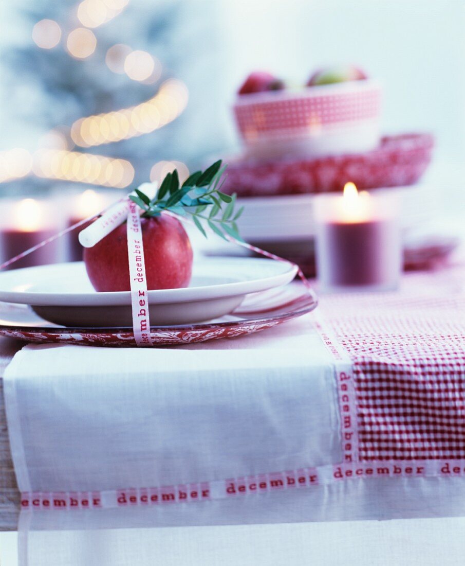 Decorative Advent place setting on red and white checked tablecloth