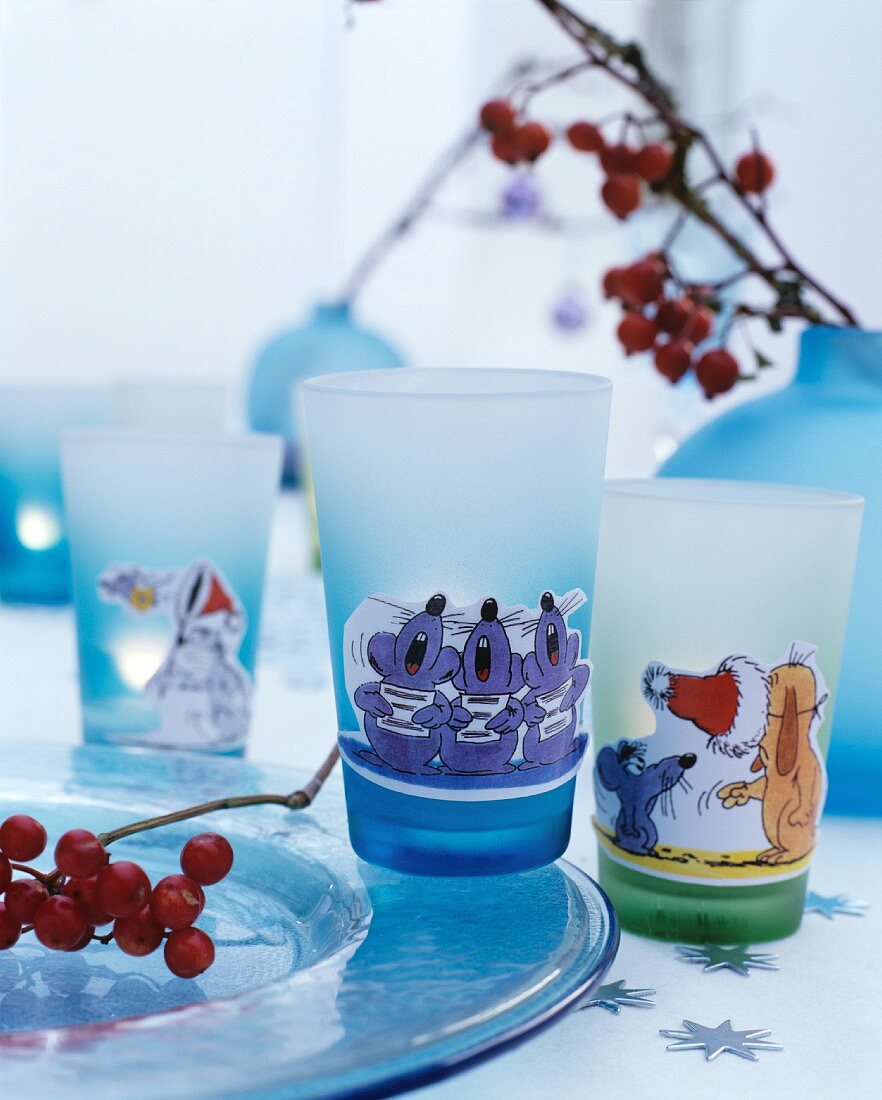 Drinking glasses with wintry cartoon motifs