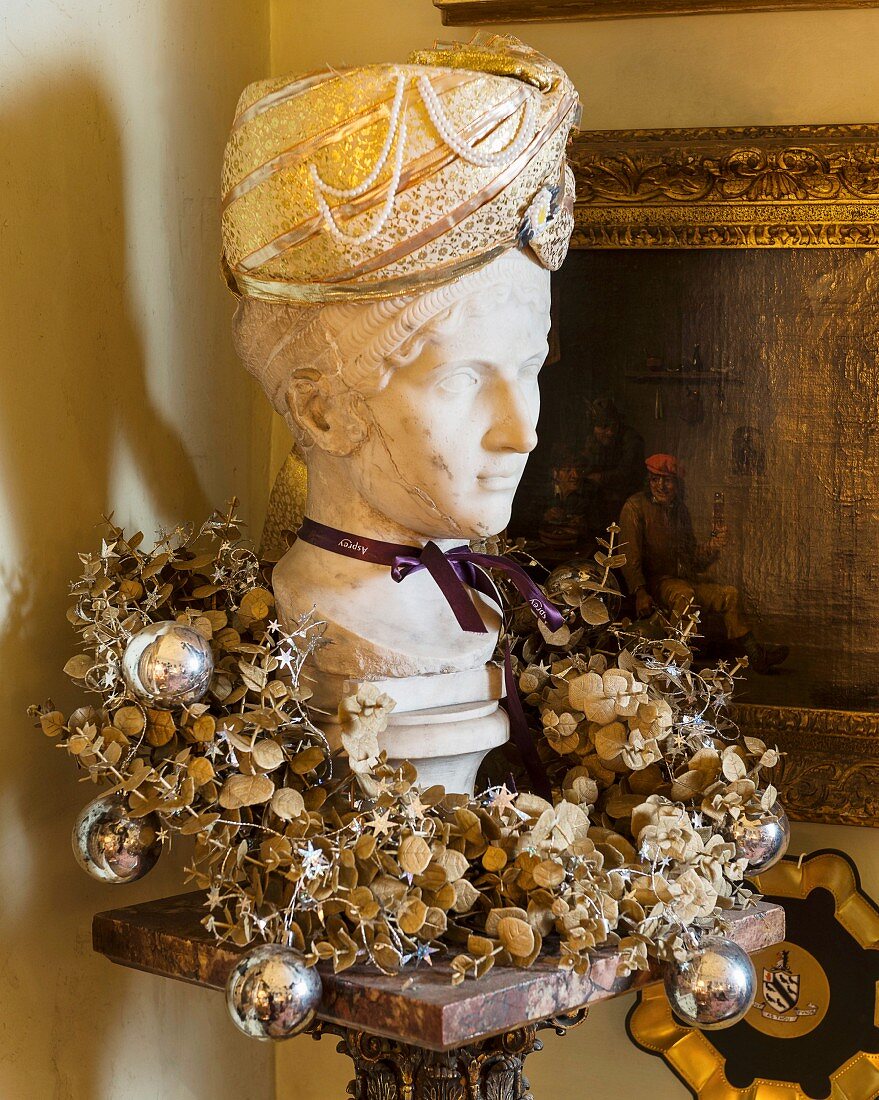 Bust of woman wearing Oriental hat and festive wreath