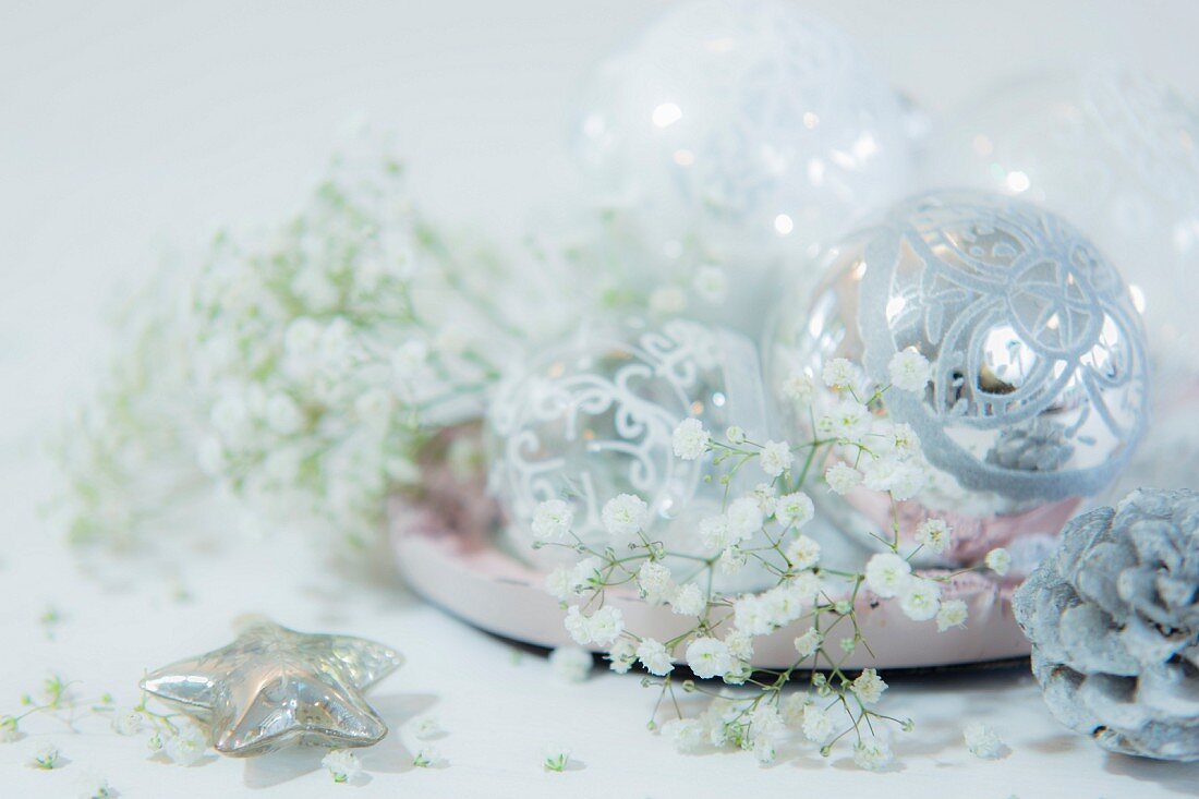 Silver baubles and gypsophila on plate