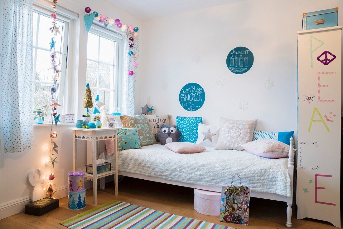 Teenager's bedroom festively decorated in pastel shades
