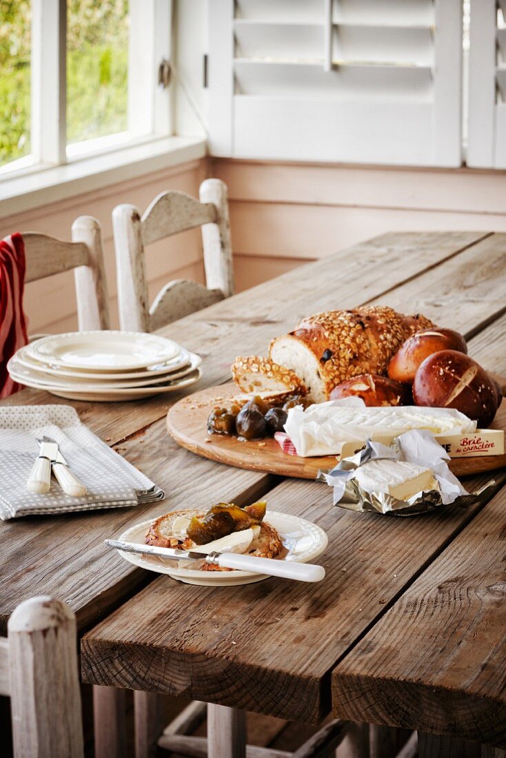 Bread and cheese on rustic wooden table