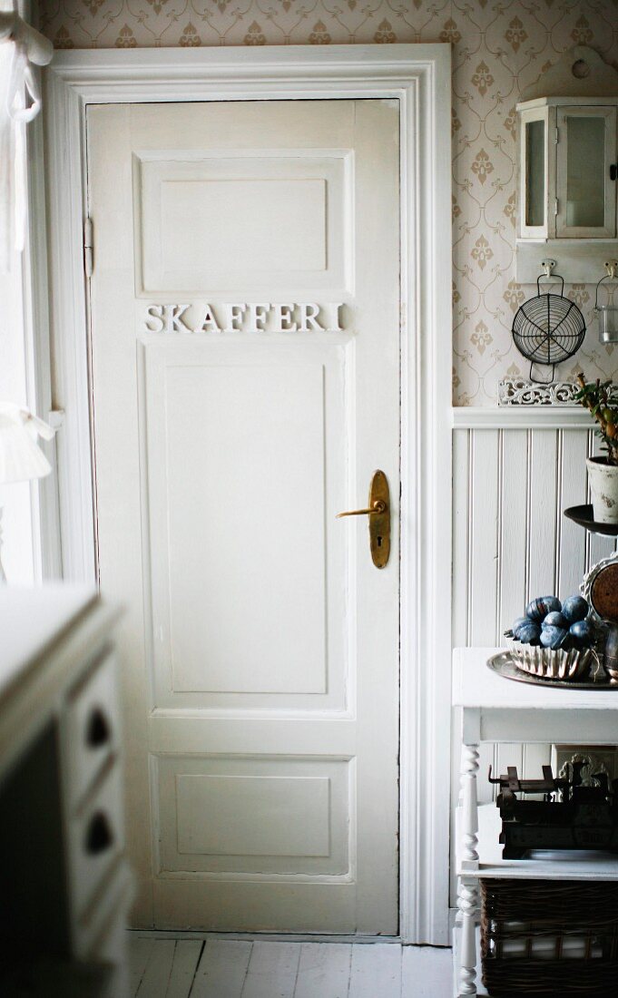 Letters attached to pantry door in rustic interior