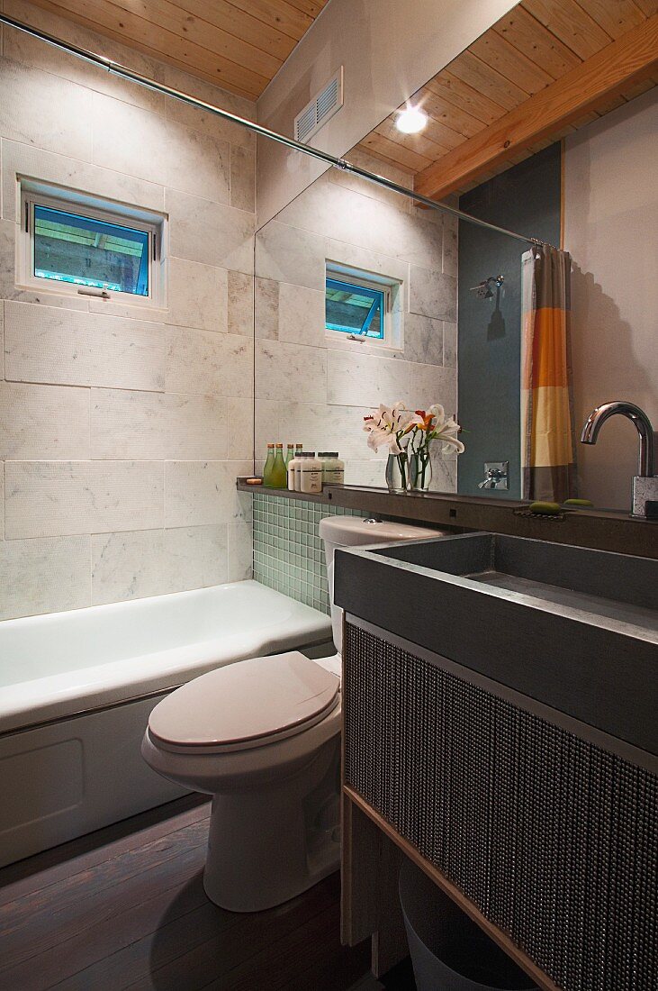 Contemporary bathroom with bathtub, washbasin and mirror; Burlington; Vermont; USA