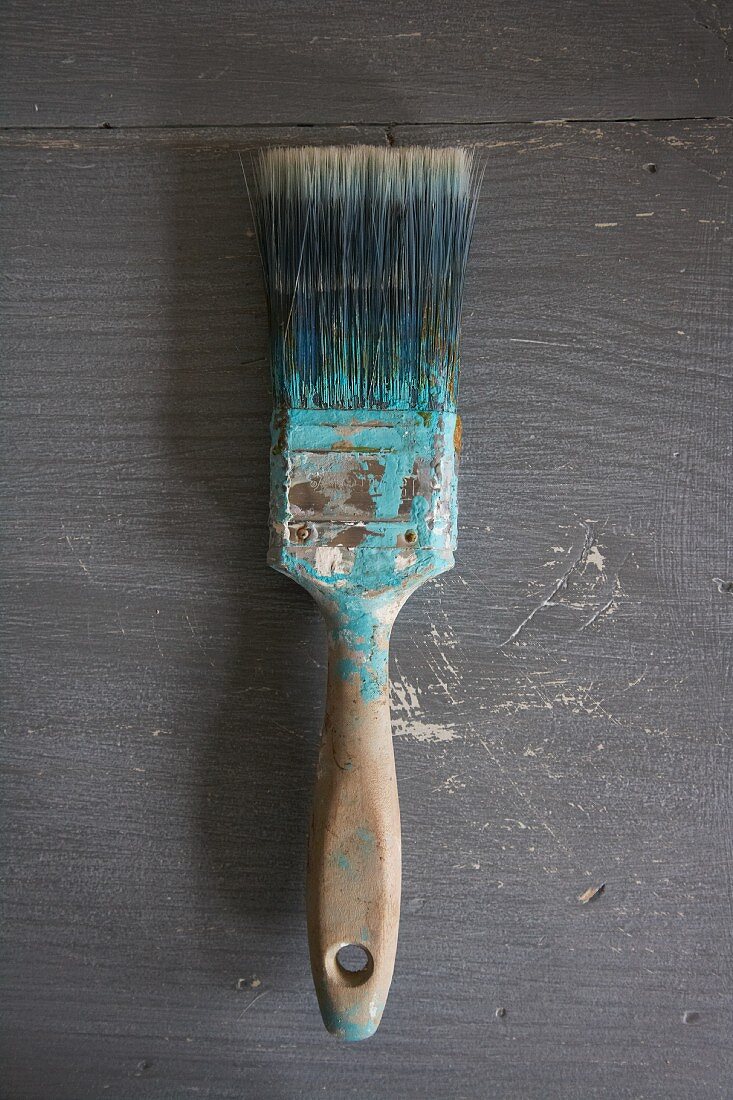 Flat paintbrush with paint residue
