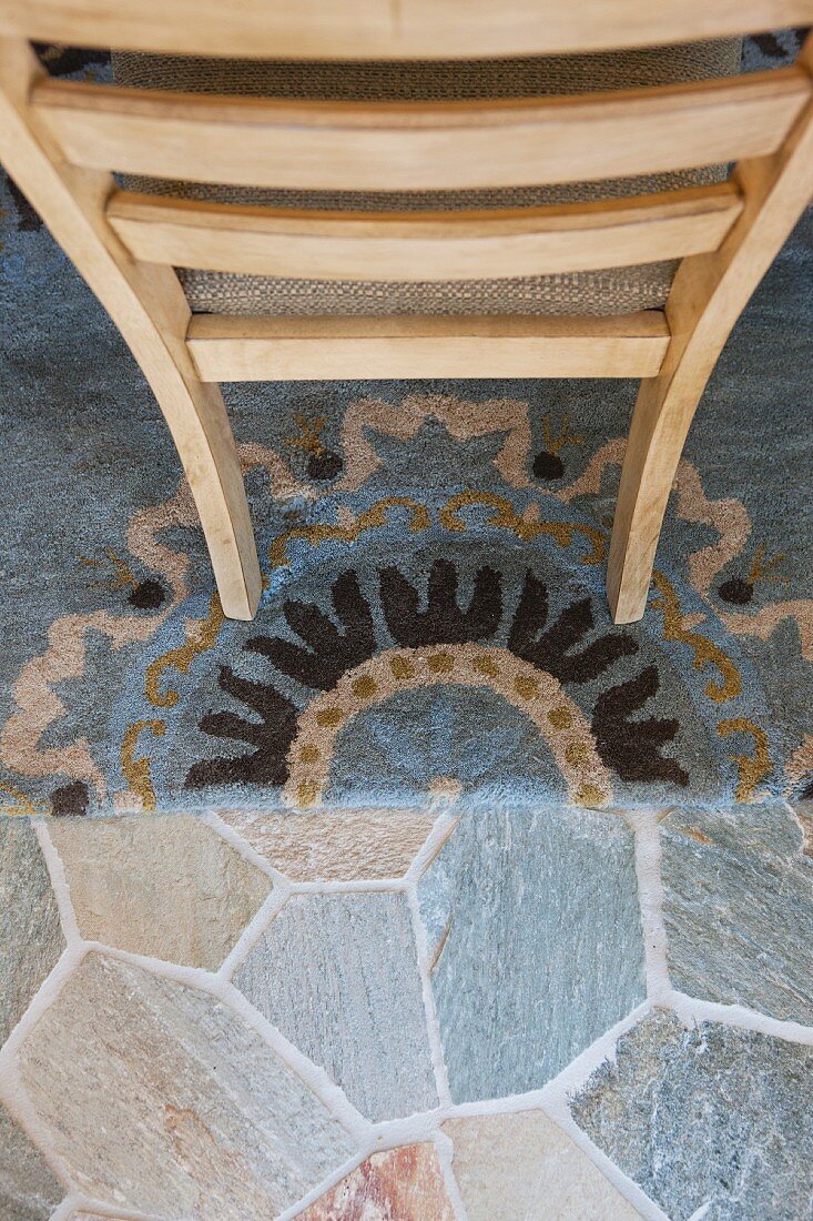 Top view of wooden chair on rug; Valencia; California; USA