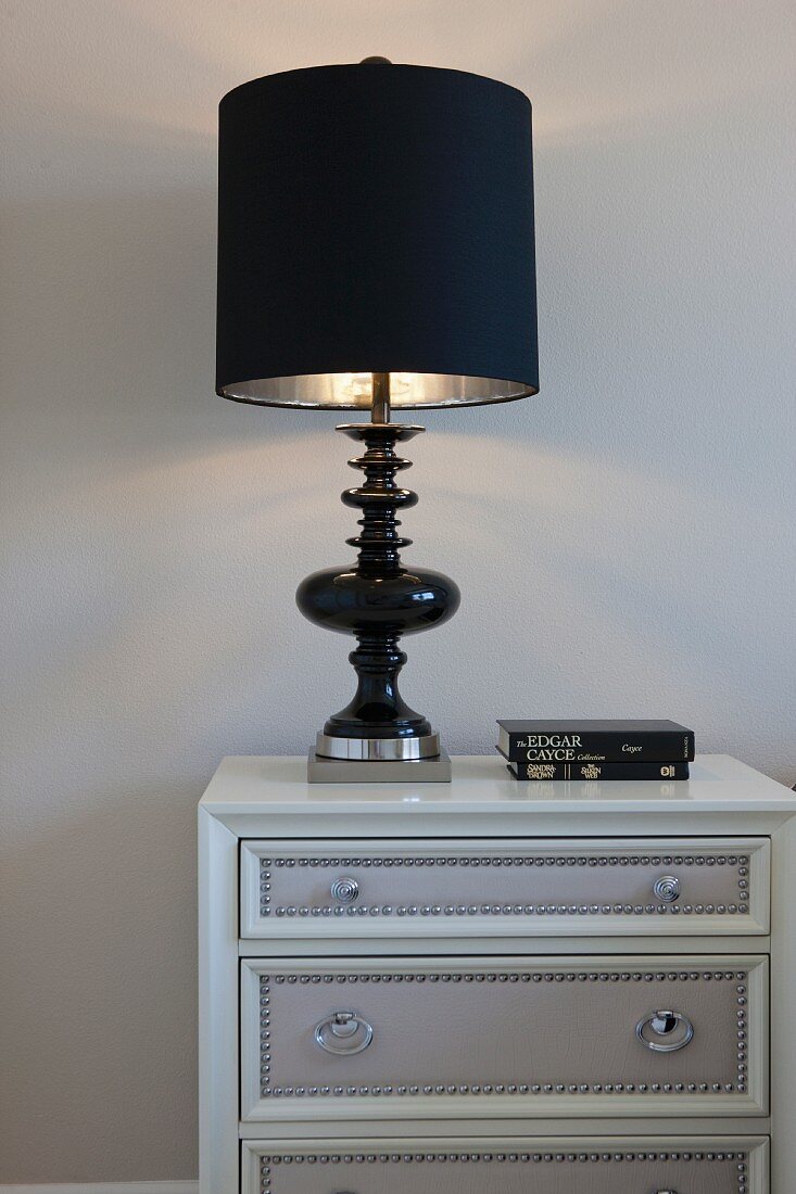 Bedside table with black lit lamp