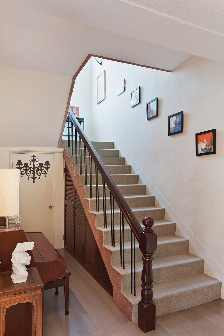 Picture frames mounted on wall along staircase