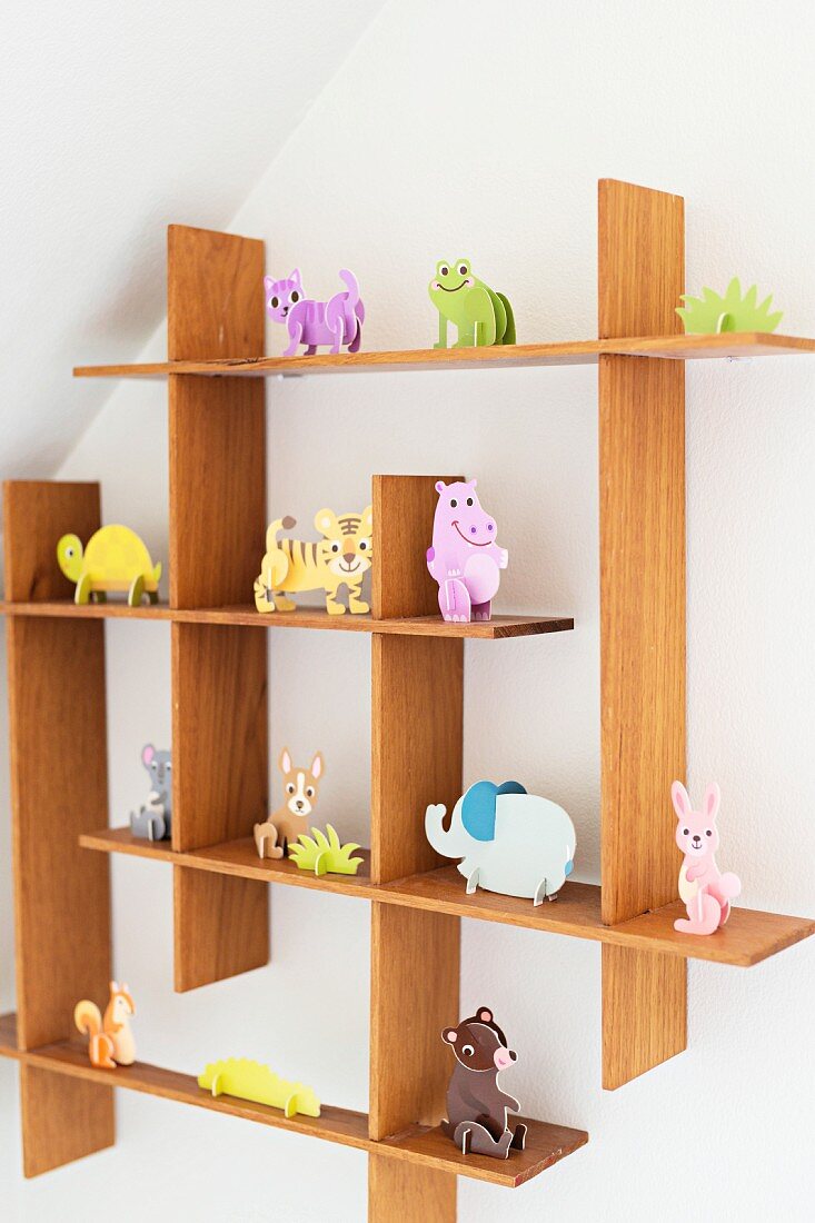 Cardboard animal ornaments on quirky shelving system