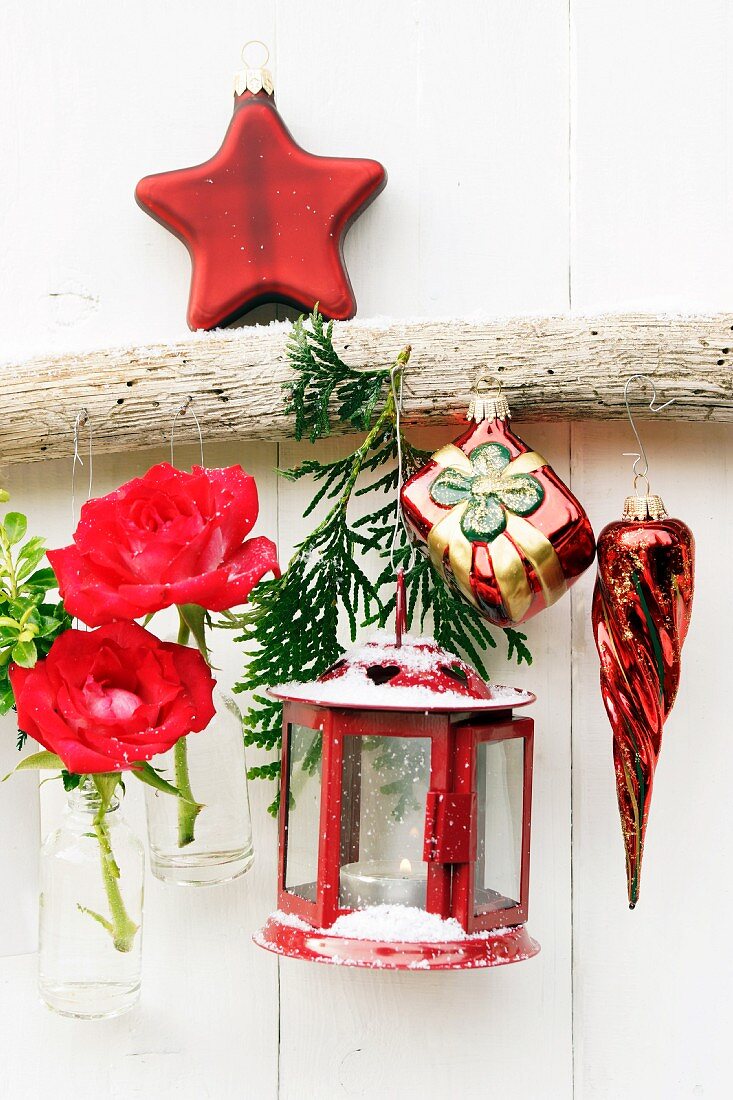 Christmas arrangement with lantern, flowers & baubles