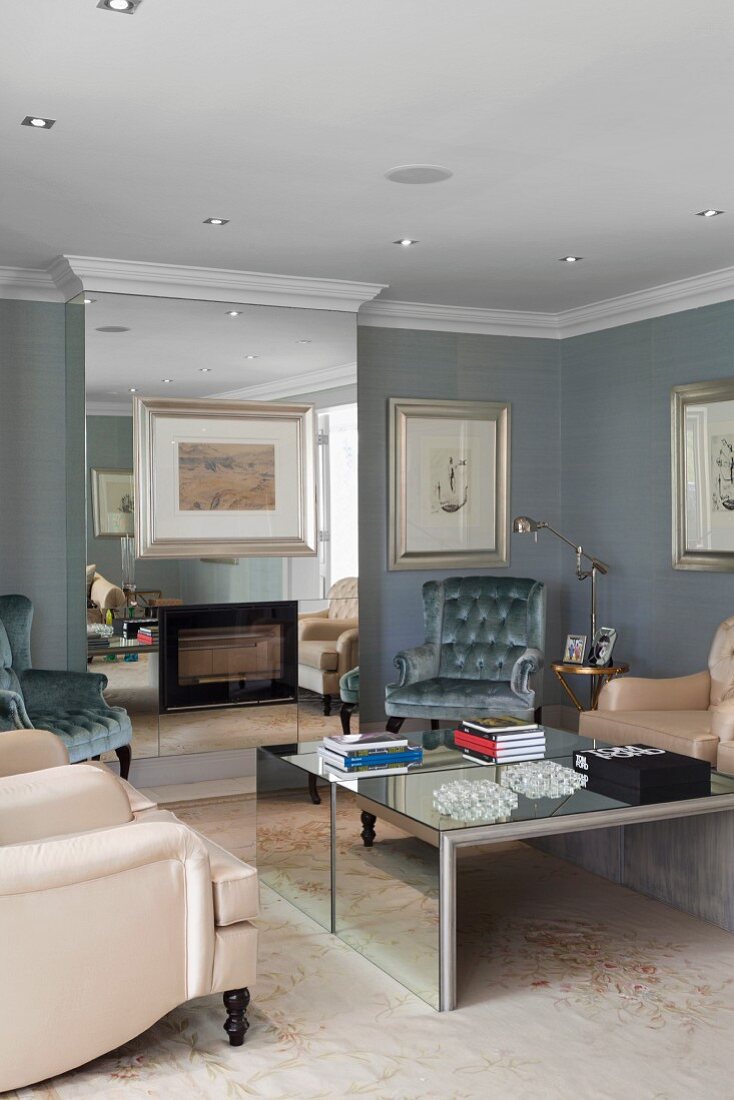 Surprising effects in mirrored chimney breast and coffee table in traditional, elegant living room