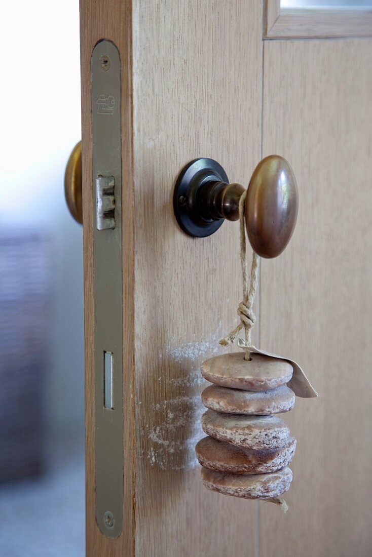 Bars of soap threaded on cord tied to doorknob