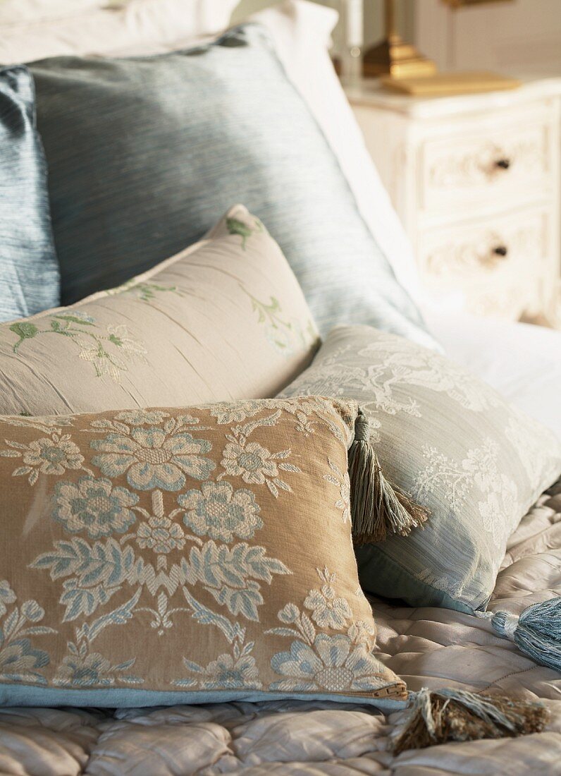 Scatter cushions with vintage covers in subtle colours
