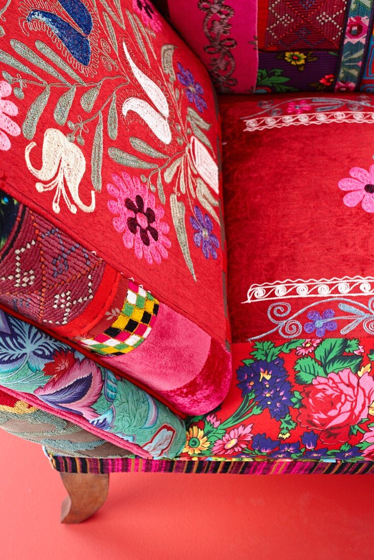 Chair with ethnic patterns on red upholstery