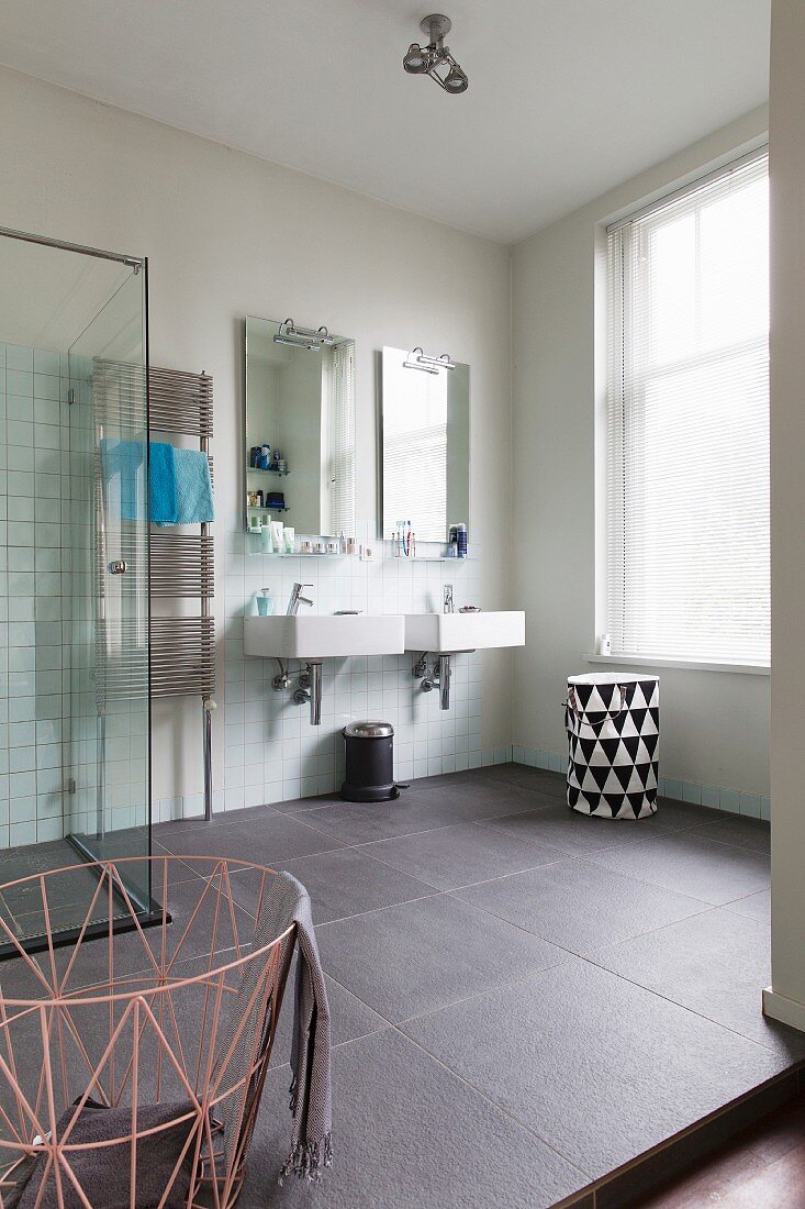 Modern bathroom with tiled floor in renovated period building