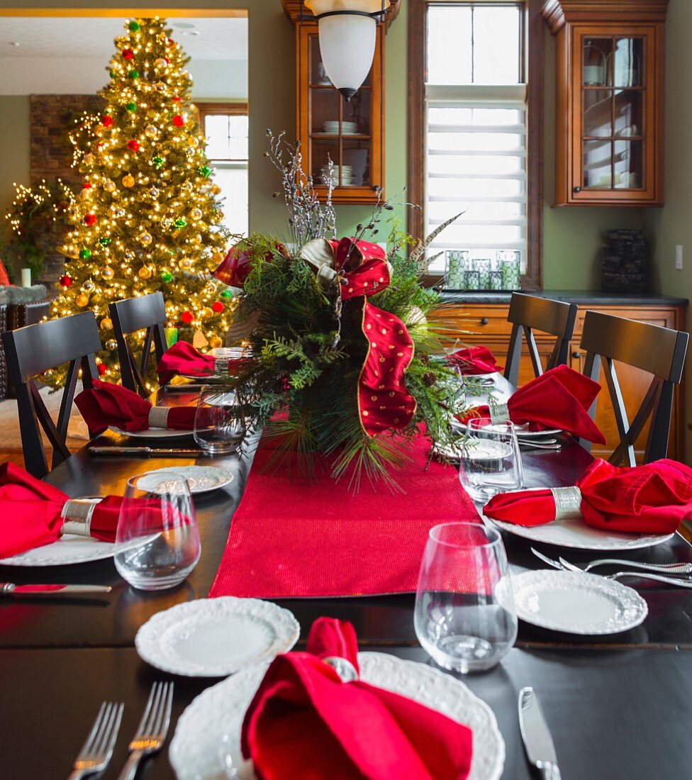 Christmas table and Christmas tree in dining room
