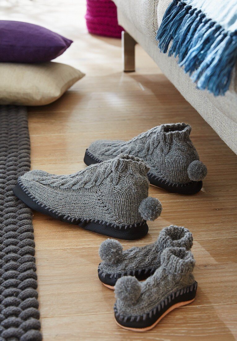 Knitted grey slippers with black leather soles