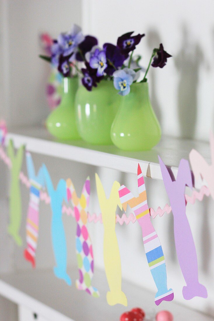 Easter garland of colourful, construction paper bunnies