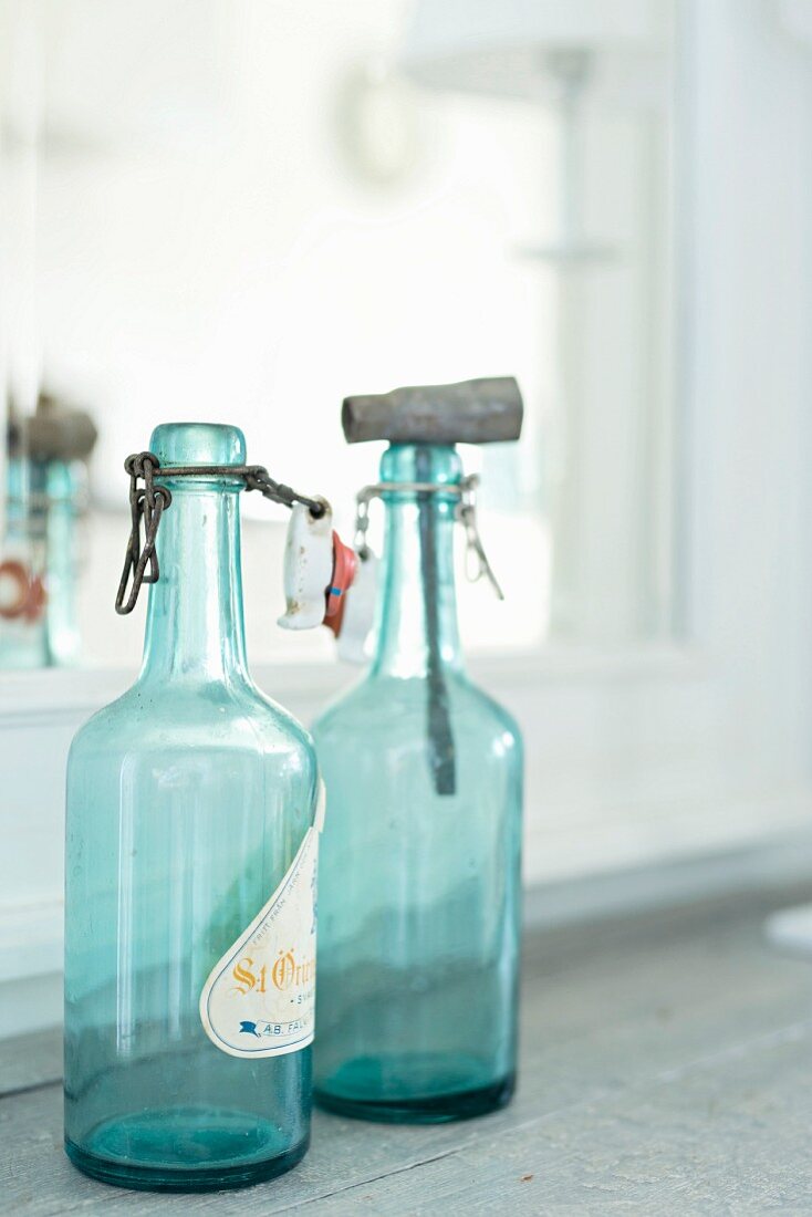 Vintage, swing-top bottles made of turquoise glass