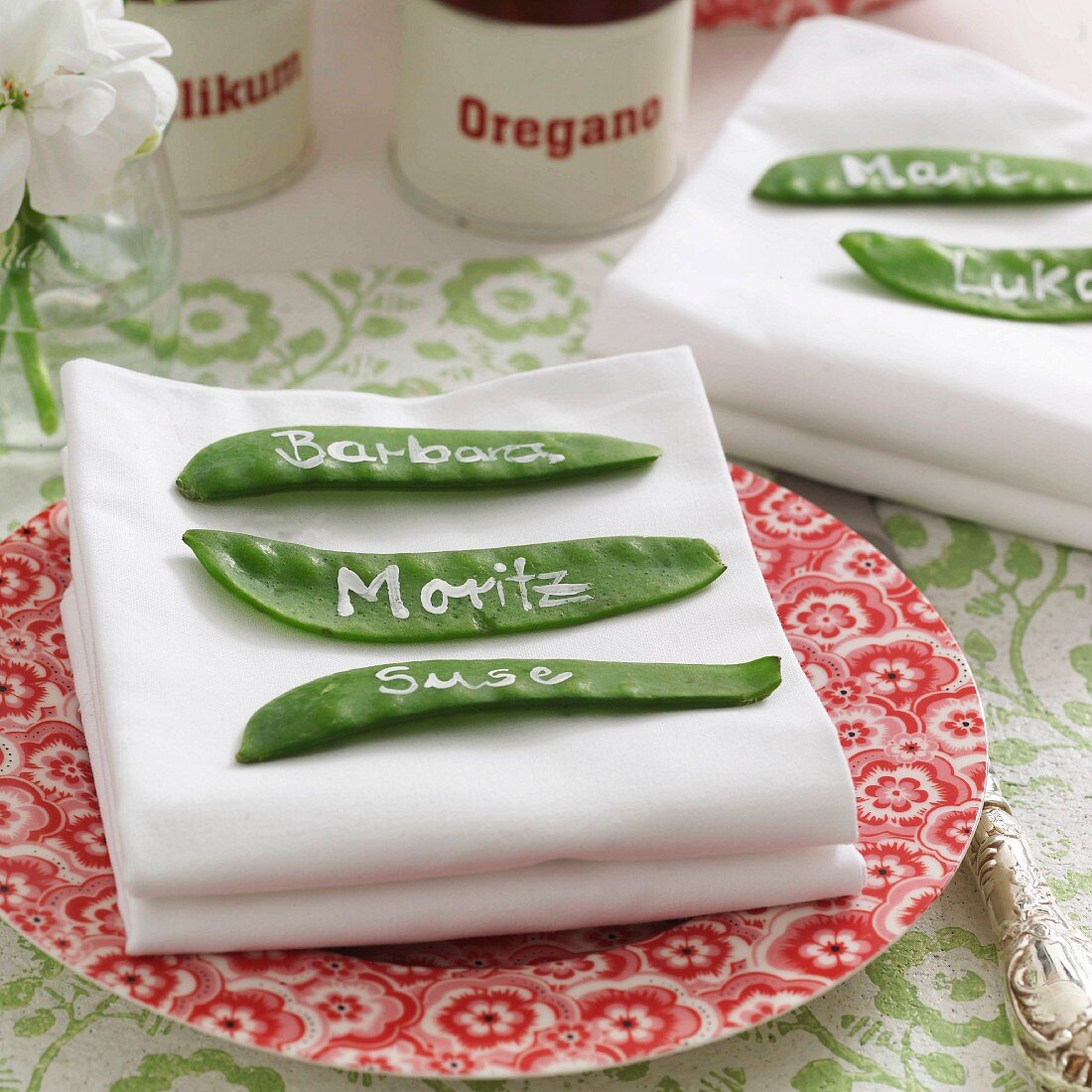 Place tags hand-made from mangetout with names written in white on place setting
