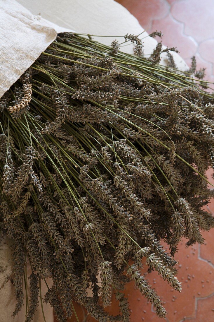 Dried lavender in linen bag on pouffe