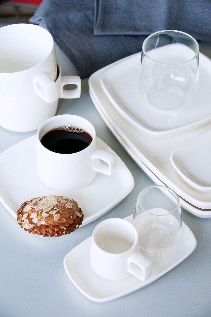 Coffee and pastry on white, hand-crafted service
